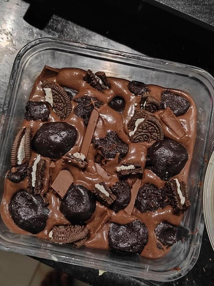 Chocolate dessert topped with sandwich cookie pieces and swirls of chocolate